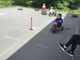 Having fun cycling around our play course.